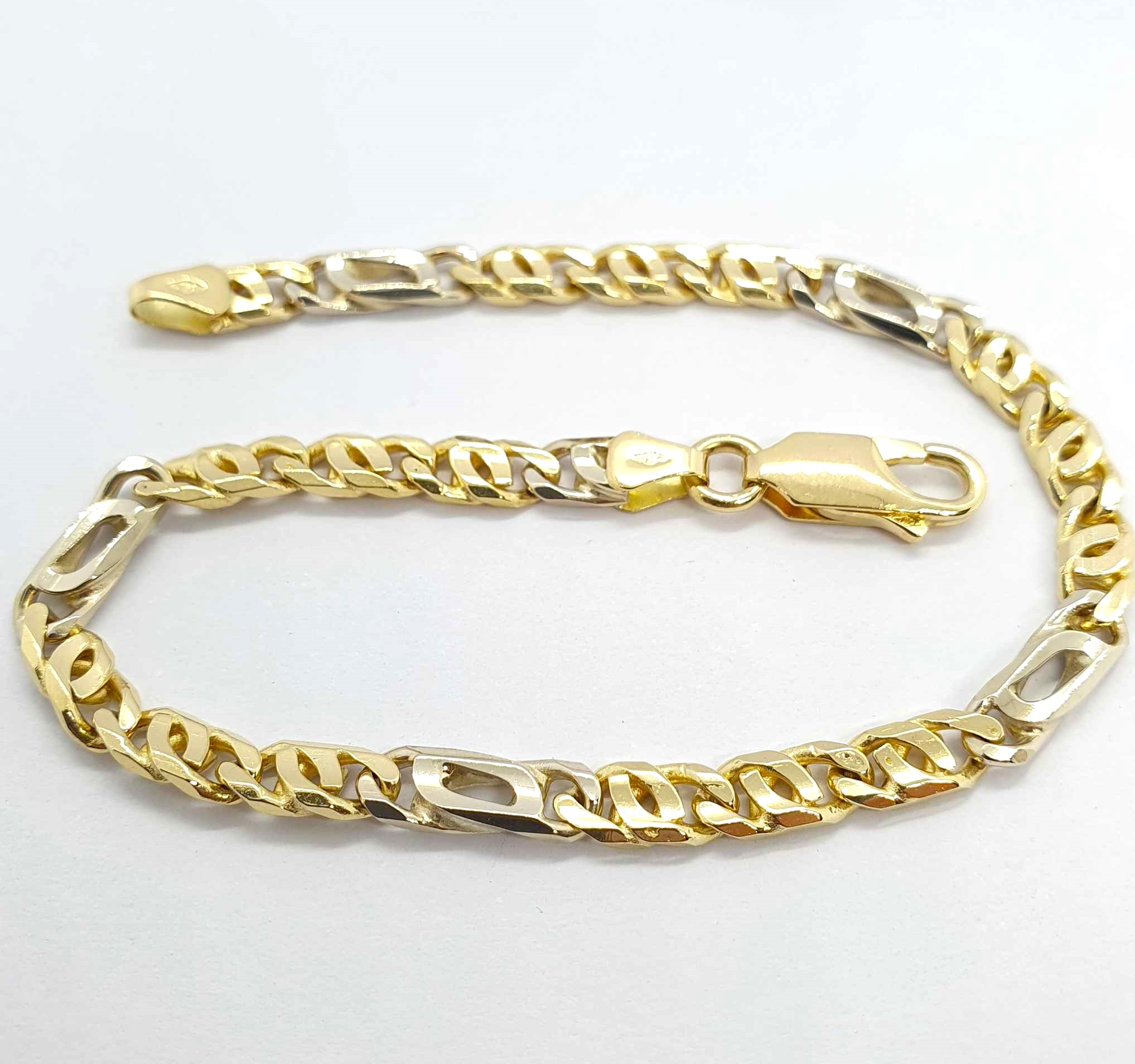 N633-129-A490-830.jpg Bracciale unisex oro giallo-bianco - immagine 1