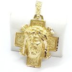 Ciondolo croce con il volto di Gesù Cristo in oro